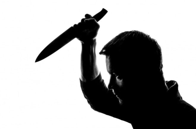 man holding up a knife