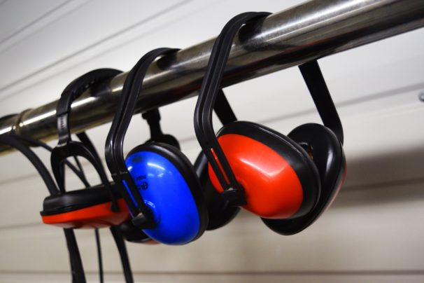 red and blue ear protectors hanging up