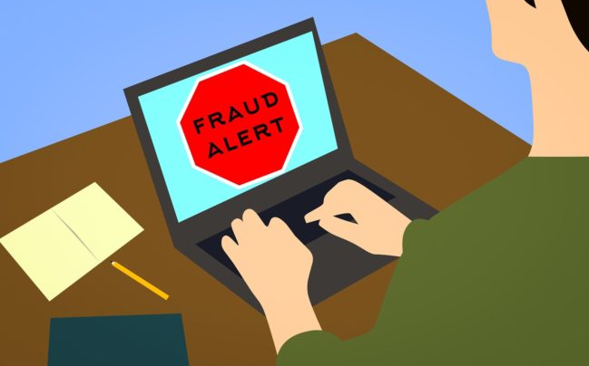 fraud alert on a laptop