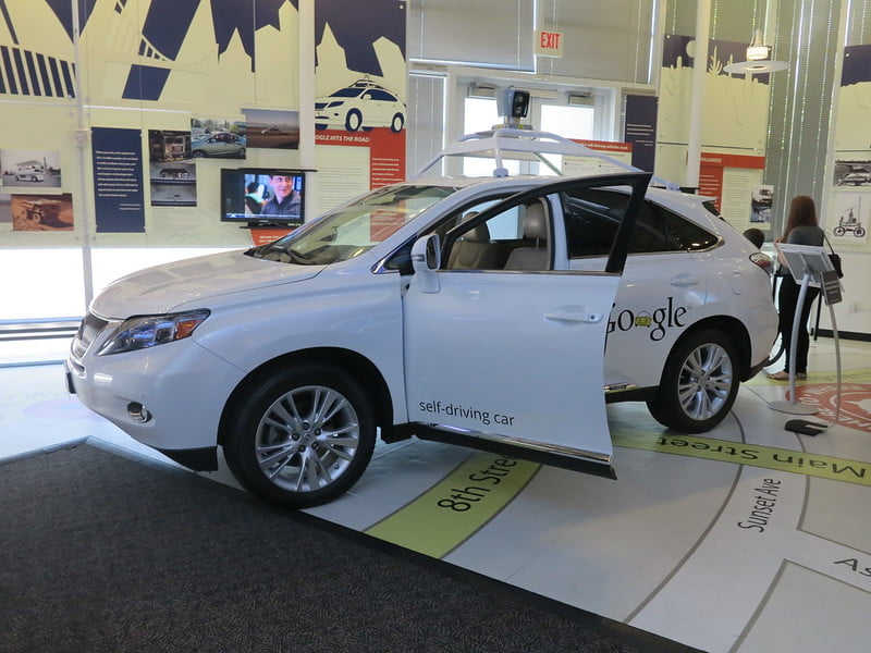 Google self-driving car with one door open, white